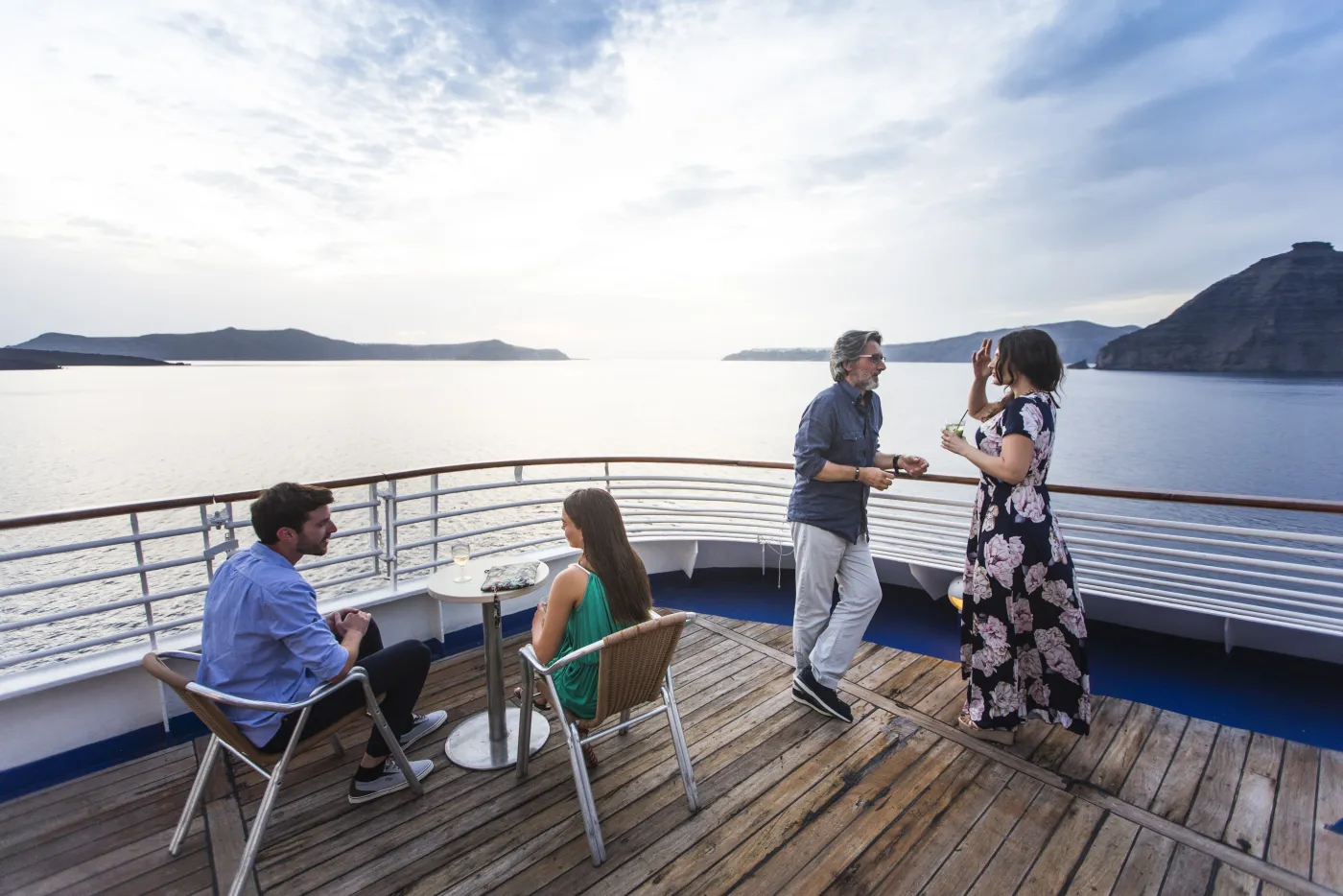 Friends relaxing over drinks on a Celestyal ship