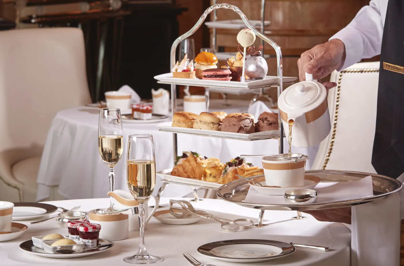 Afternoon tea being poured on a Cunard veranda