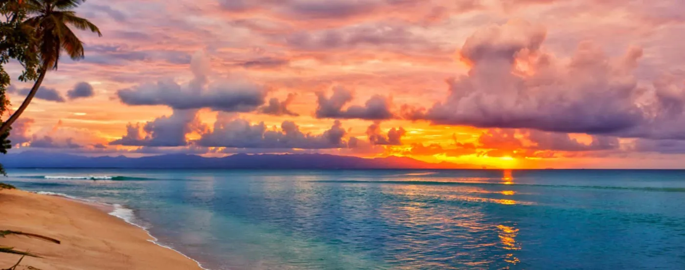 A Caribbean beach at sunset