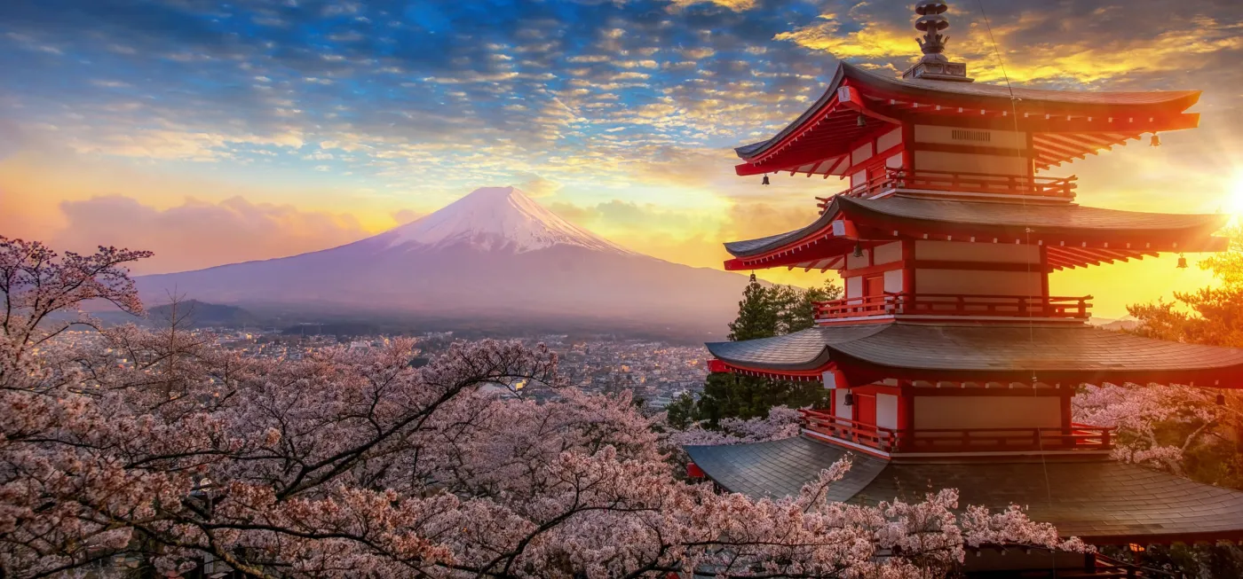 Mount Fuji behind a pagoda in cherry blossom
