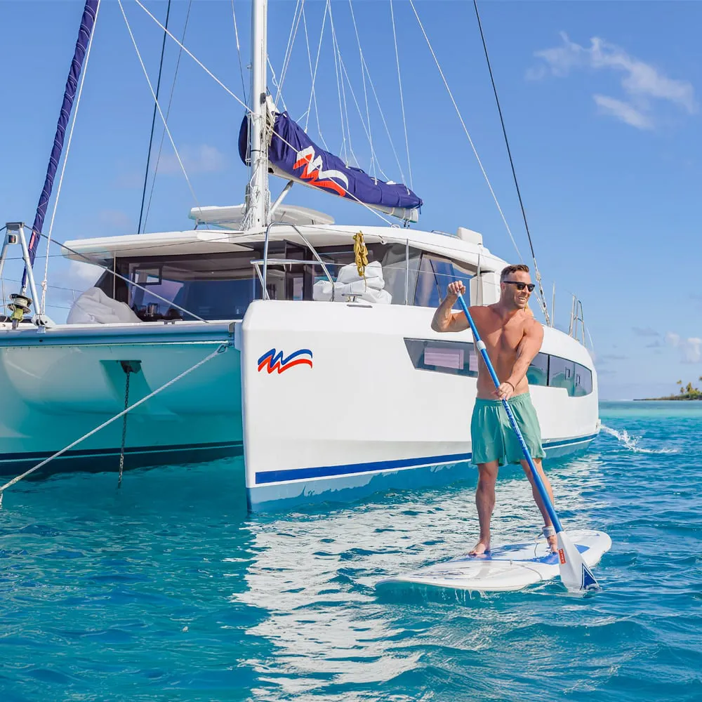 A Moorings sailing catamaran in turquoise water