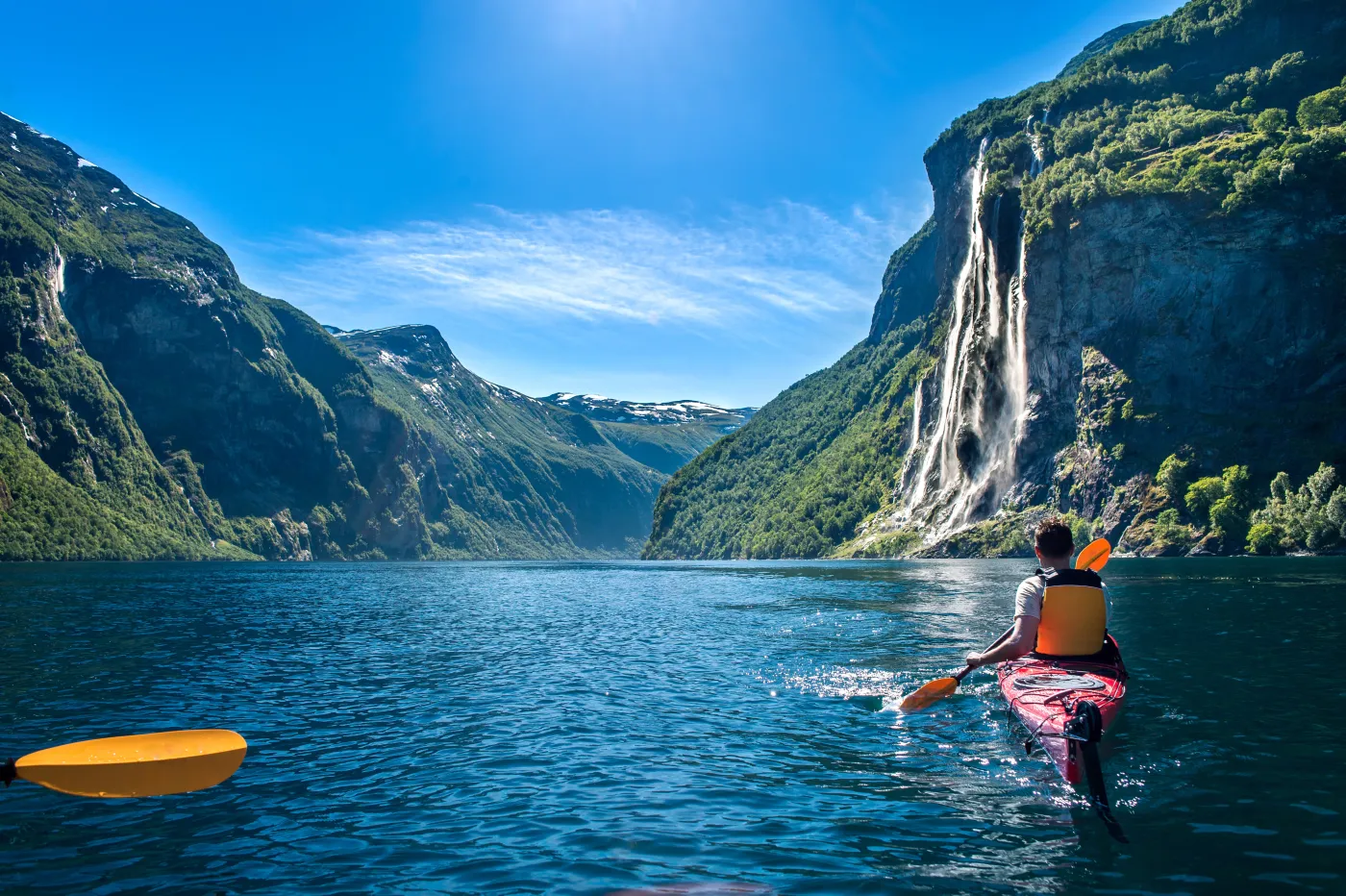 Kayaking in Norway's Geirangerfjord beneath the Seven Sisters waterfall