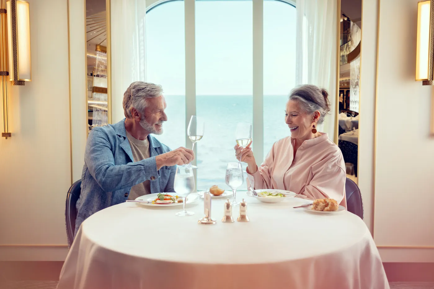 Guests dining in the Britannia Restaurant on Queen Anne